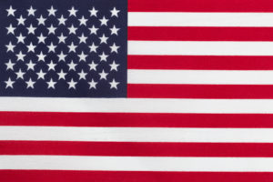 Close up of United States of America flag in horizontal layout. Cloth Texture.